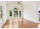 Bright sunroom with hardwood floors, large windows, and backyard view at 1545 Center Cross Pass, Marietta, GA 30062
