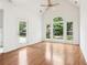 Sunroom with large windows, hardwood floors, and an exit door to the backyard at 1545 Center Cross Pass, Marietta, GA 30062