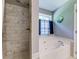 Bathroom with a marble walk-in shower and separate soaking tub with tiled surround at 1720 Alcovy River Dr, Dacula, GA 30019