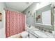 Bright bathroom featuring a granite vanity top, tiled floors, and a shower/tub combo at 1720 Alcovy River Dr, Dacula, GA 30019