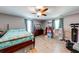 Large bedroom with wood flooring, a ceiling fan, and ample natural light at 1720 Alcovy River Dr, Dacula, GA 30019