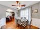 Charming breakfast nook with views of the kitchen and dining room featuring hardwood floors at 1720 Alcovy River Dr, Dacula, GA 30019