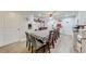 Spacious dining room offers ample seating and light-colored wood flooring at 1720 Alcovy River Dr, Dacula, GA 30019