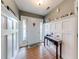 Inviting foyer featuring stylish wainscoting, hardwood floors, and decorative shelving at 1720 Alcovy River Dr, Dacula, GA 30019
