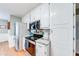Well lit kitchen featuring white cabinets, stainless steel appliances, and granite countertops at 1720 Alcovy River Dr, Dacula, GA 30019
