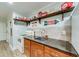 Kitchenette featuring upper display shelves, a sleek counter and wooden cabinets at 1720 Alcovy River Dr, Dacula, GA 30019