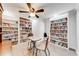 Home library with floor to ceiling bookshelves and a dedicated reading area at 1720 Alcovy River Dr, Dacula, GA 30019