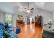 Spacious living room featuring vaulted ceilings, hardwood floors, and a brick fireplace at 1720 Alcovy River Dr, Dacula, GA 30019