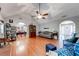 Open concept living room featuring hardwood floors, vaulted ceilings and neutral decor at 1720 Alcovy River Dr, Dacula, GA 30019