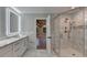 Bathroom featuring dual sinks, marble countertop, tile backsplash, glass enclosed shower, marble tile flooring at 194 Jennifer Nw Ln, Lilburn, GA 30047