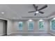 Spacious bedroom with ceiling fan and recessed lighting plus three windows at 194 Jennifer Nw Ln, Lilburn, GA 30047