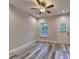 Bedroom features wood-look floors, neutral walls, and a ceiling fan with integrated light fixture at 194 Jennifer Nw Ln, Lilburn, GA 30047