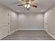 Bedroom with two doors, fan and recessed lighting, and vinyl floors at 194 Jennifer Nw Ln, Lilburn, GA 30047