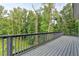 Large wooden deck with railing overlooking trees at 194 Jennifer Nw Ln, Lilburn, GA 30047
