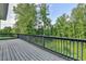 Spacious wooden deck overlooking lush greenery at 194 Jennifer Nw Ln, Lilburn, GA 30047