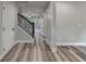 Hallway featuring hardwood floors, recessed lighting, and decorative staircase at 194 Jennifer Nw Ln, Lilburn, GA 30047