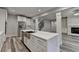 Open kitchen featuring a marble island, gas range, and stainless steel appliances at 194 Jennifer Nw Ln, Lilburn, GA 30047