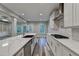 Open kitchen featuring a marble island, gas range, and stainless steel appliances at 194 Jennifer Nw Ln, Lilburn, GA 30047