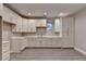 Modern kitchen featuring stainless steel appliances and bright white cabinetry at 194 Jennifer Nw Ln, Lilburn, GA 30047