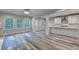Bright living room featuring a fireplace, large windows, and hardwood floors, perfect for Gathering gatherings at 194 Jennifer Nw Ln, Lilburn, GA 30047