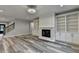 Inviting living room with fireplace, built-in shelving, and stylish flooring, ideal for relaxing and entertaining at 194 Jennifer Nw Ln, Lilburn, GA 30047
