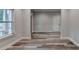 Bright living room with hardwood floors, neutral paint, and a large window at 194 Jennifer Nw Ln, Lilburn, GA 30047