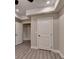 Room featuring hardwood floors, recessed ceiling lights, and multiple doors at 194 Jennifer Nw Ln, Lilburn, GA 30047