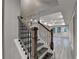 Elegant staircase with dark wood railings and white risers at 194 Jennifer Nw Ln, Lilburn, GA 30047