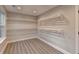 Spacious walk-in closet with custom shelving and ample storage space at 194 Jennifer Nw Ln, Lilburn, GA 30047
