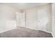 Neutral bedroom with two doors, carpeted floors, and a window providing natural light at 2044 Glendale Dr, Decatur, GA 30032