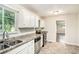 Clean kitchen with stainless steel appliances, granite countertops, and natural light at 2044 Glendale Dr, Decatur, GA 30032
