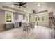 Beautiful basement kitchenette with grey cabinets, stainless appliances, and a large window overlooking the yard at 2855 Drayton Hall Dr, Buford, GA 30519