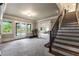 Spacious basement featuring a staircase, exercise equipment and access to the pool at 2855 Drayton Hall Dr, Buford, GA 30519