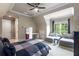 Bedroom featuring a ceiling fan, window seating, and ample natural light at 2855 Drayton Hall Dr, Buford, GA 30519
