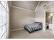 Simple bedroom featuring a large window, striped bedding, and an adjoining bathroom at 2855 Drayton Hall Dr, Buford, GA 30519