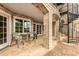 Charming covered brick patio with a spiral staircase and outdoor seating area at 2855 Drayton Hall Dr, Buford, GA 30519