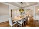 Bright dining room with hardwood floors, modern light fixture, and archways at 2855 Drayton Hall Dr, Buford, GA 30519
