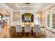 Elegant dining room featuring hardwood floors, modern lighting, and designer decor at 2855 Drayton Hall Dr, Buford, GA 30519