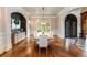 Spacious dining room with wood floors, stylish lighting, and large windows at 2855 Drayton Hall Dr, Buford, GA 30519