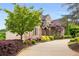 Elegant home with meticulously landscaped front yard and circular driveway at 2855 Drayton Hall Dr, Buford, GA 30519
