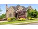 Stunning brick home with meticulously maintained landscaping and a welcoming front entrance at 2855 Drayton Hall Dr, Buford, GA 30519