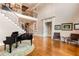 Spacious foyer featuring a grand staircase and a piano, creating an inviting entrance at 2855 Drayton Hall Dr, Buford, GA 30519