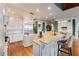 Open kitchen with granite counters, white cabinets, and stainless steel appliances at 2855 Drayton Hall Dr, Buford, GA 30519