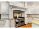 Bright kitchen with Viking range, custom cabinets, and granite countertops at 2855 Drayton Hall Dr, Buford, GA 30519