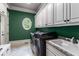Well-equipped laundry room with modern appliances, ample storage, and a sink for added convenience at 2855 Drayton Hall Dr, Buford, GA 30519