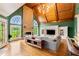 Comfortable living room with a vaulted wood ceiling, stone fireplace, and built-in entertainment center at 2855 Drayton Hall Dr, Buford, GA 30519