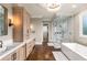 Bright main bathroom with marble countertop, sleek shower, and modern fixtures at 2855 Drayton Hall Dr, Buford, GA 30519