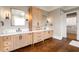 Modern main bathroom with double vanities, stylish fixtures, and a view of a walk-in closet at 2855 Drayton Hall Dr, Buford, GA 30519