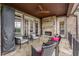 Charming outdoor patio with a stone fireplace and comfortable seating, perfect for relaxation at 2855 Drayton Hall Dr, Buford, GA 30519