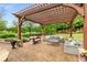 Inviting pergola-covered patio with stylish seating, perfect for outdoor entertaining and relaxation at 2855 Drayton Hall Dr, Buford, GA 30519